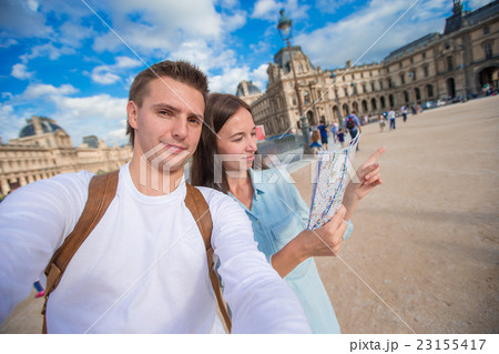 Happy young family with map of european city 23155417