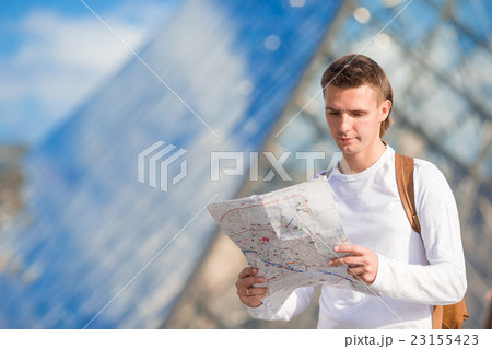 Young tourist man with map in european city 23155423