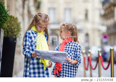 Adorable little girls with map of european city Adorable little girls with map of european city 23155438
