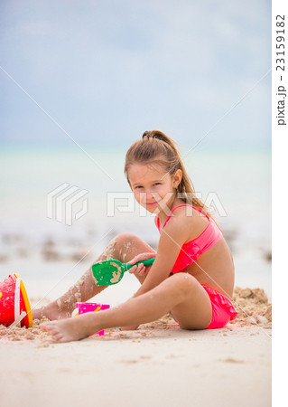 Adorable little girl playing with toys during Adorable little girl playing with toys during 23159182