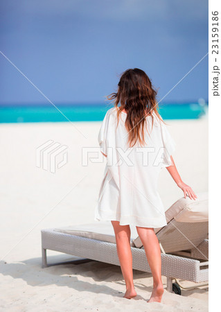 Young beautiful woman on beach vacation Young beautiful woman on beach vacation 23159186