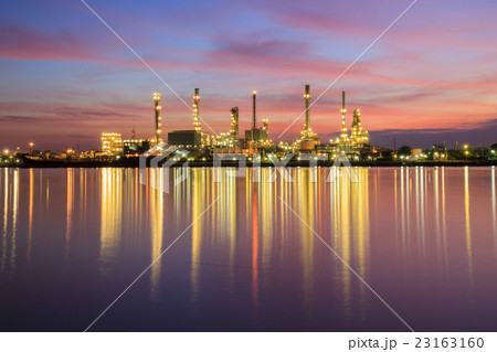Oil refinery along the river at Dusk 23163160