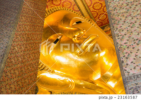 Close up Reclining Buddha gold statue 23163587