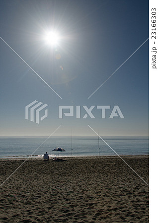 Lone man fishing on a sunny day, Spain 23166303