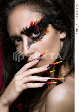 Beautiful girl in image of Phoenix bird with 23166429