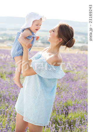 Young mother and daughter in lavender field Young mother and daughter in lavender field 23169243