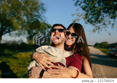 young family with a child on the nature 23170024