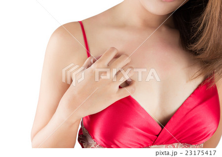 Woman scratching her itchy chest Woman scratching her itchy chest 23175417