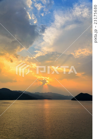 Sunset over a mountain at lake Sunset over a mountain at lake 23175680