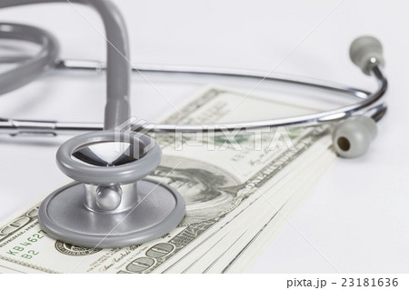 Stethoscope on a pile of money, depicting health 23181636
