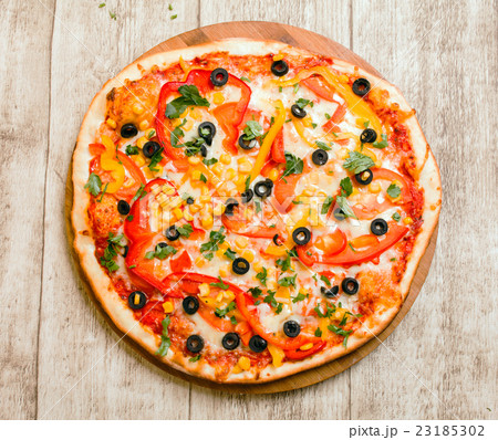 pizza on the wood background 23185302