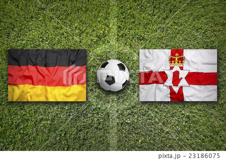 Germany vs. Northern Ireland flags on soccer field 23186075