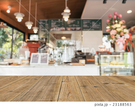 wooden table top with blured coffee shop 23188563