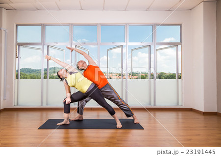 Series of Extended Side Angle yoga partner pose 23191445