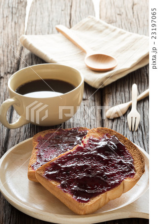 breakfast, toast and jam with black coffee  23197065