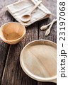 Empty round wooden plate on wood table background 23197068