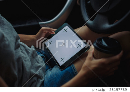 woman with tablet in the car woman with tablet in the car 23197789