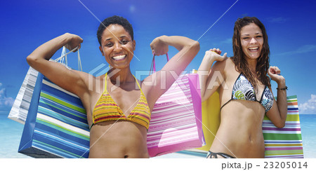 Women with shopping bags on a tropical beach concept Women with shopping bags on a tropical beach concept 23205014