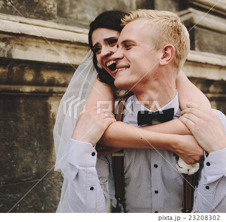 groom carries bride on his back groom carries bride on his back 23208302