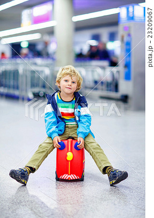 little tired kid boy at the airport, traveling little tired kid boy at the airport, traveling 23209067