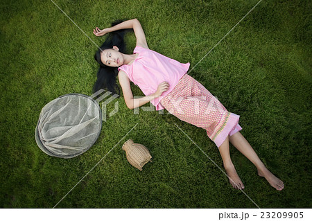 Girl lying on prairie  23209905