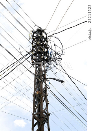 Many wires on an old electric pole Many wires on an old electric pole 23211522