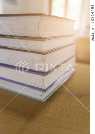 old book with blur library background old book with blur library background 23214493