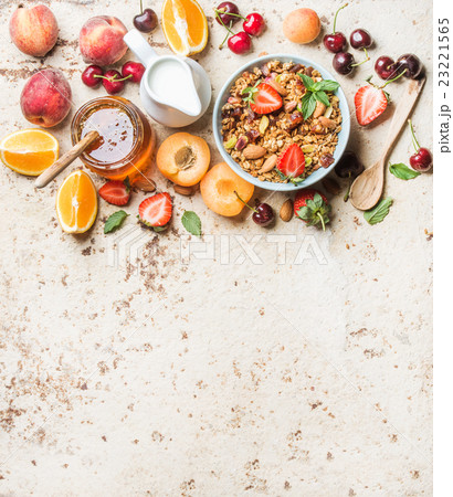 Healthy breakfast ingredients. Bowl of oat granola 23221565