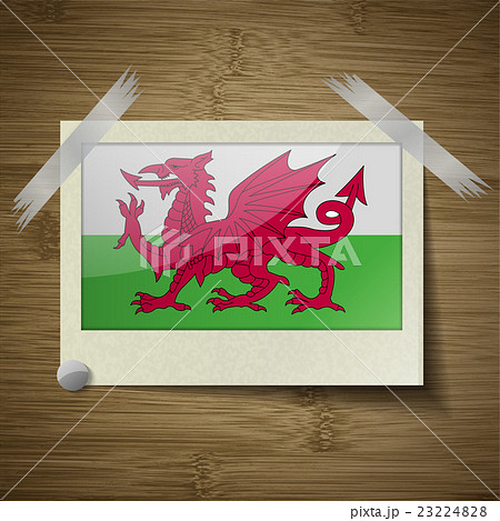 Flags Wales at frame on wooden texture. Vector 23224828