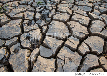 cracked clay ground, drought land background 23227427