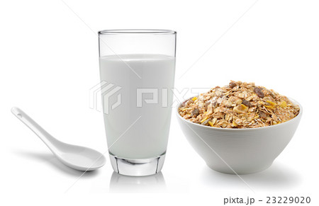 milk in the glass and muesli breakfast placed  23229020