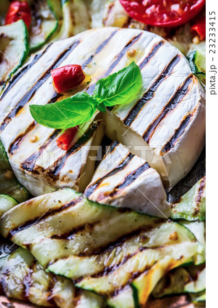 Grill Brie camembert cheese zucchini with chili. 23233415