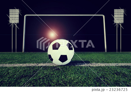 Soccer ball on green field 23236725