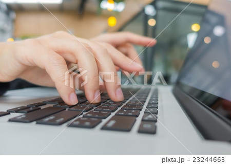 Closeup of business woman hand typing on laptop keyboard . Closeup of business woman hand typing on laptop keyboard . 23244663