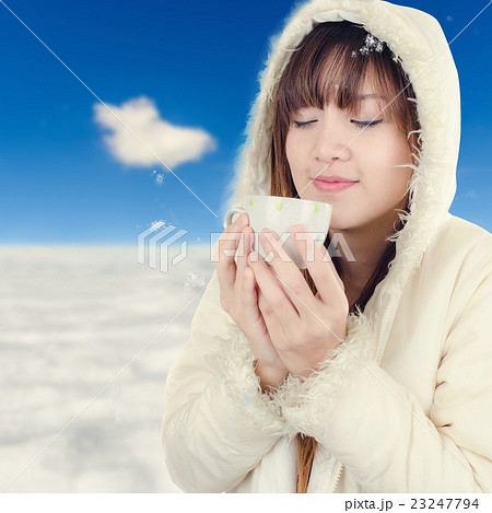 Beautiful Woman with winter anorak and mug Beautiful Woman with winter anorak and mug 23247794