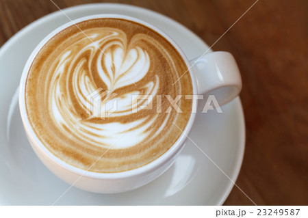 Close-up cup of latte coffee on wooden  23249587