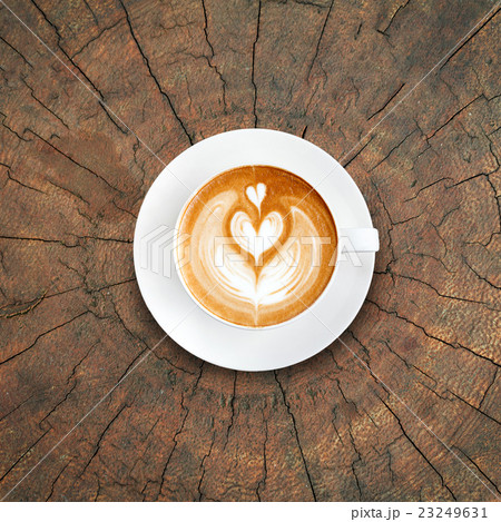 Top view latte art coffee on tree stump background Top view latte art coffee on tree stump background 23249631