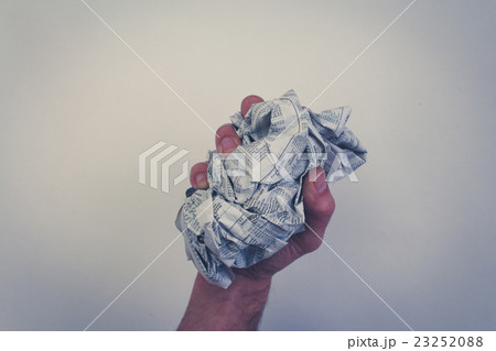 hand , fist holding screwed newspaper, hand , fist holding screwed newspaper, 23252088