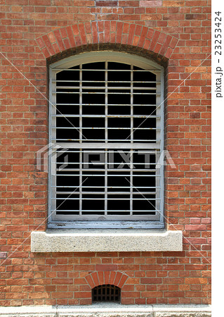 レンガ造りの建物の窓 はめ込み画像用にガラス部は黒で塗りつぶしの写真素材