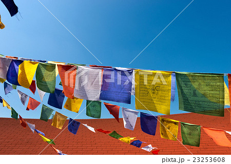 Colorful Buddhist Praying Flags on Blue Sky Colorful Buddhist Praying Flags on Blue Sky 23253608