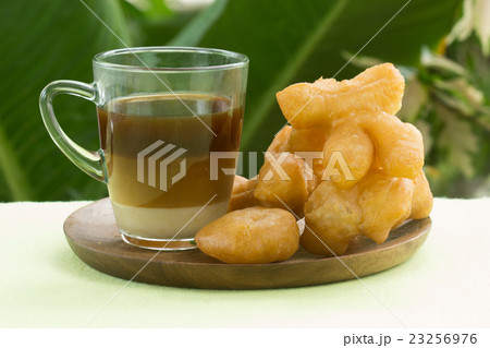 deep fried dough stick with hot coffee deep fried dough stick with hot coffee 23256976