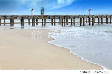 Cement bridge long on the beach into the sea Cement bridge long on the beach into the sea 23257800