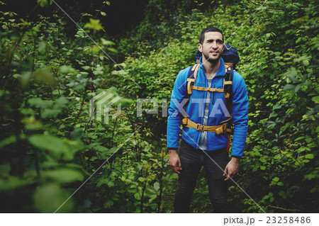 Male traveler standing in the bushes Male traveler standing in the bushes 23258486