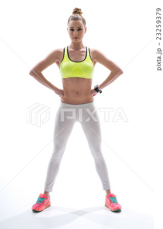 Cheerful young woman is posing with confidence 23259379
