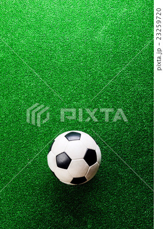 Soccer ball against artificial turf. Studio shot Soccer ball against artificial turf. Studio shot 23259720