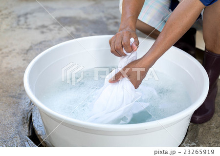 Womwn hands wash stain of dirty clothes Womwn hands wash stain of dirty clothes 23265919