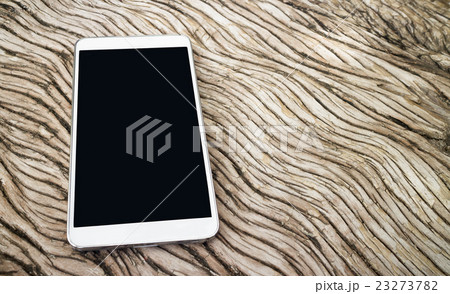 Smart phone on the wooden seamless background 23273782