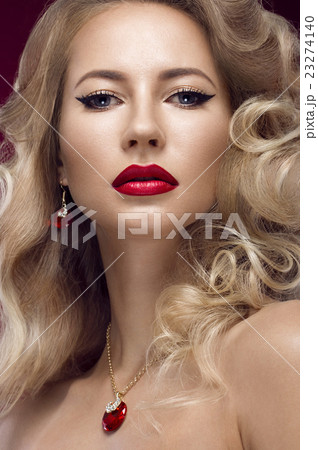 Beautiful blonde in a Hollywood manner with curls 23274140