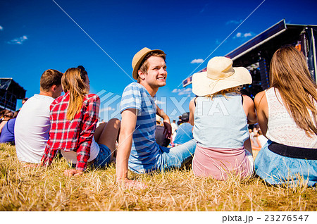 Teenagers, summer music festival, sitting in front Teenagers, summer music festival, sitting in front 23276547