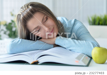 beautiful woman sleeping on book beautiful woman sleeping on book 23277403